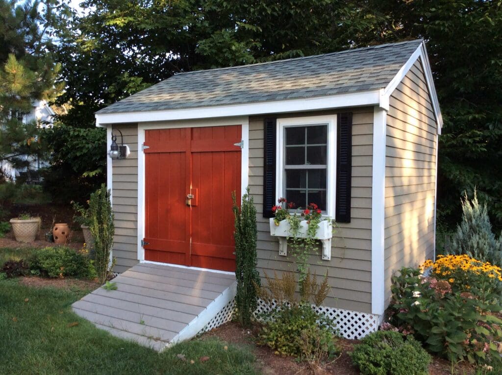 Backyard Shed with Red Door and Nice Landscaping